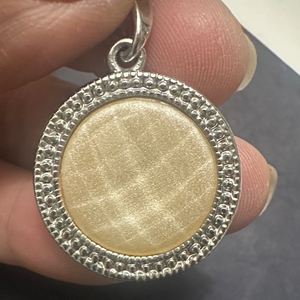 Elegant Gold and Silver Pendant